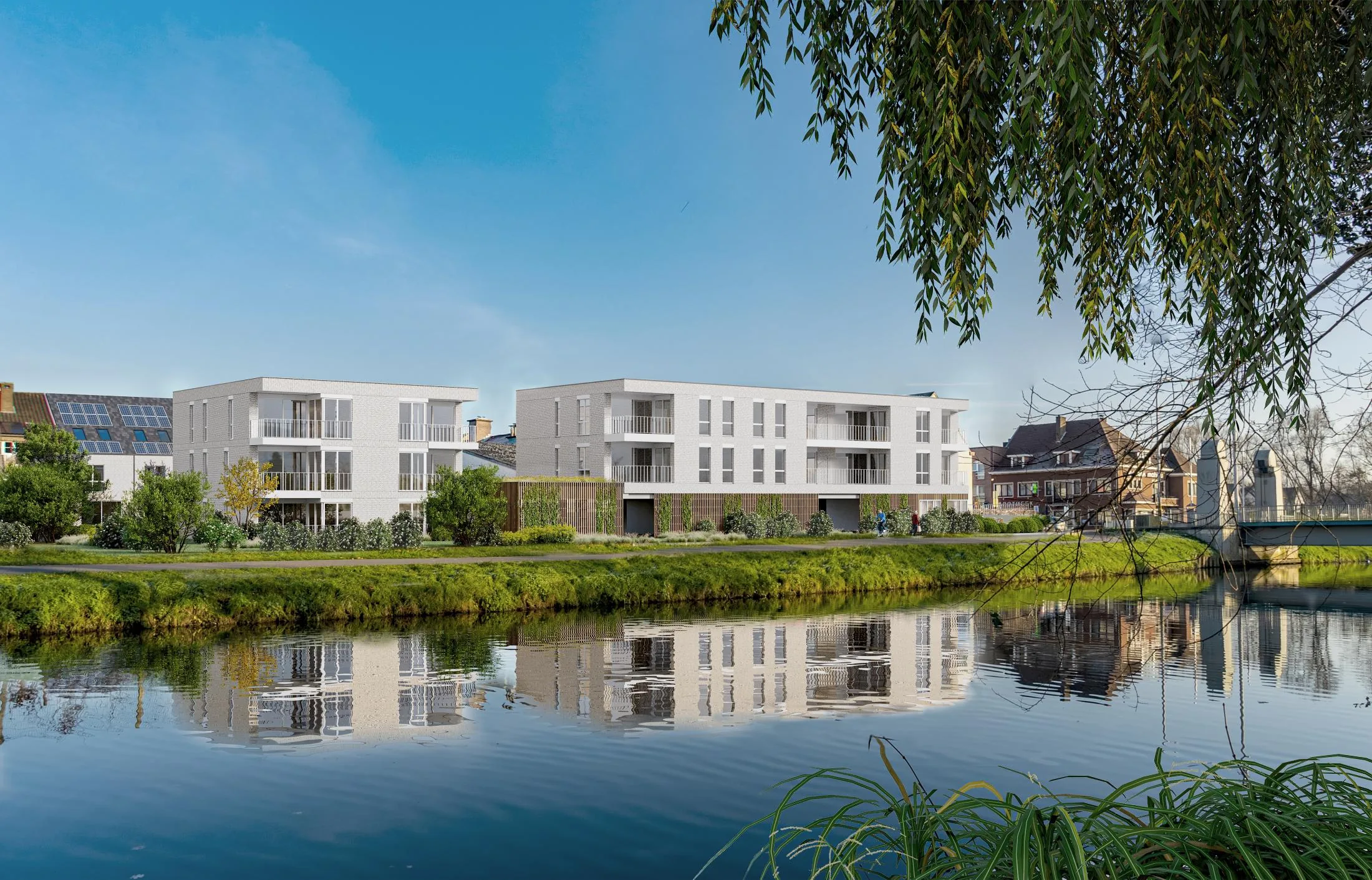 Het appartementsgebouw van Morris aan de Dender, weerspiegeld in het water